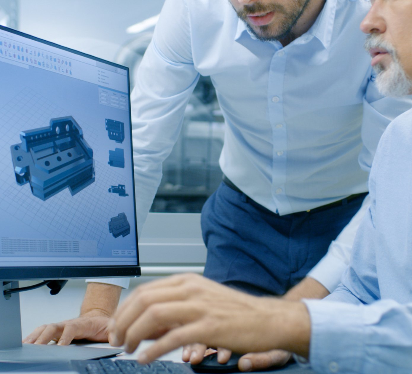 man using a computer to evaluate 3D images with an employee